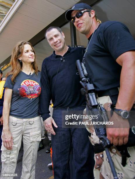 Metairie, UNITED STATES: Movie star couple Kelly Preston and John Travolta stop and visit first responders at the Jefferson Parish Sherrif Operations...