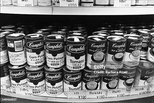 Cans of Campbell's soup, with labels in English and Japanese, on display in a Tokyo department store, February 1988.