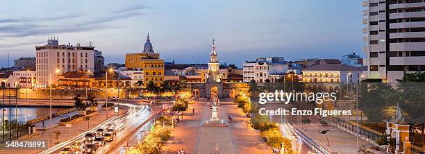 clock tower gate at dusk - cartagena colombia stock pictures, royalty-free photos & images