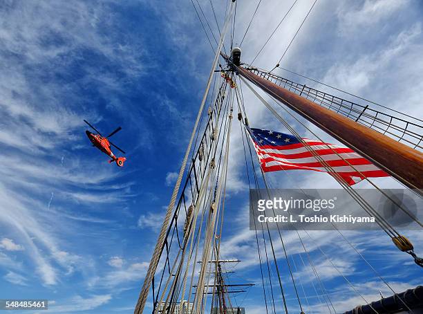 coast guard helicopter and tall ship - guardacostas fotografías e imágenes de stock