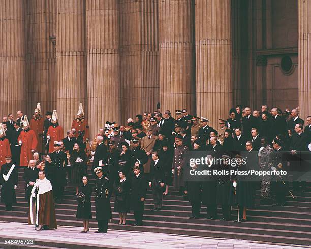 Queen Elizabeth II and Prince Philip, The Duke of Edinburgh stand with members of the British royal family and International dignitaries on the steps...