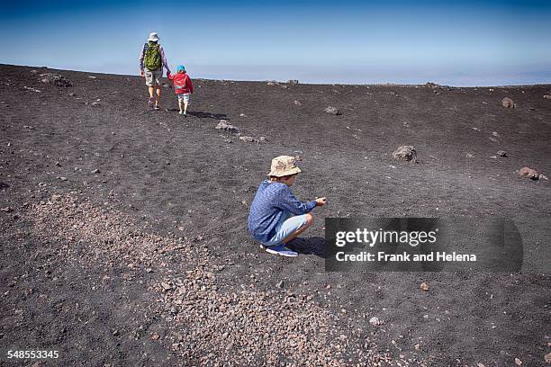 senior woman and two grandsons on mount etna, catania, sicily, italy - frank catania stock-fotos und bilder