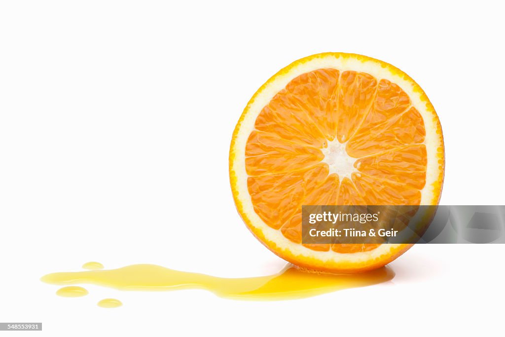 Halved orange with juice
