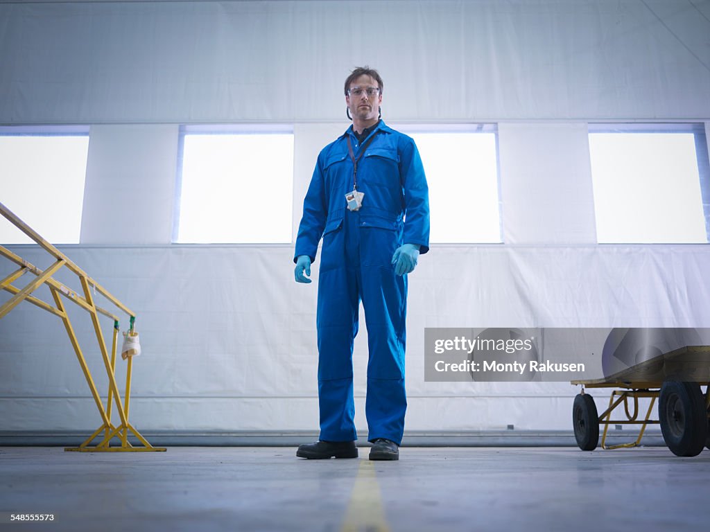 Portrait of aircraft engineer in aircraft maintenance factory