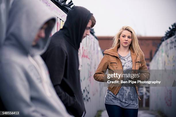 teenagers standing against wall with graffiti - 18 wall stock pictures, royalty-free photos & images