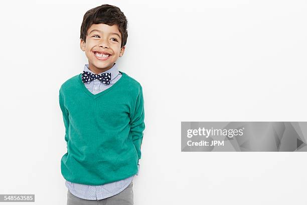 boy looking preppy with bow tie - neckline stock pictures, royalty-free photos & images