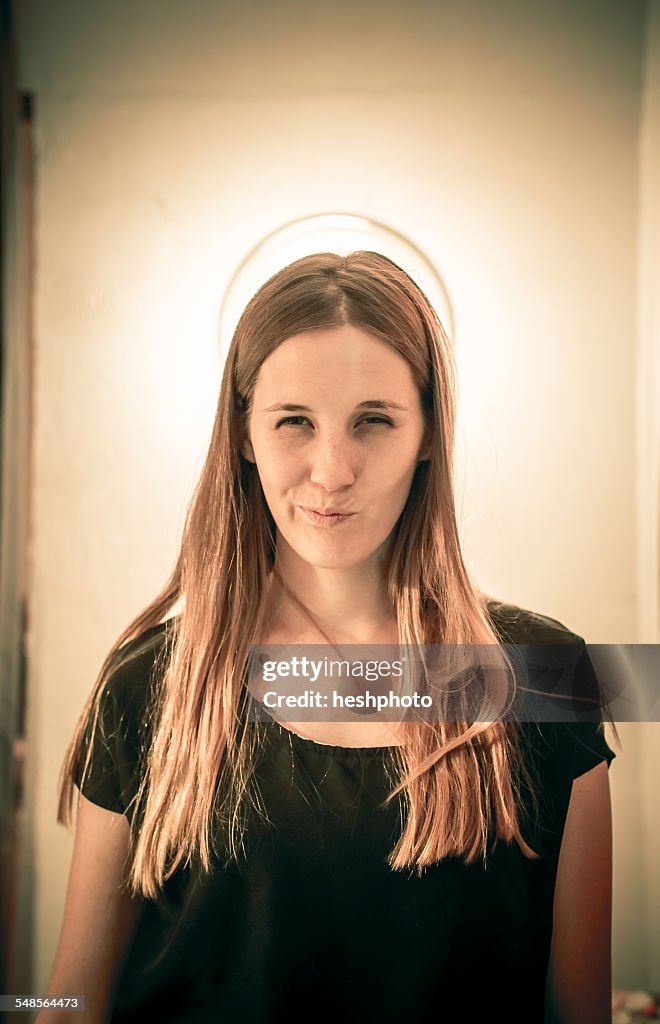 Mid adult woman with black eye and halo