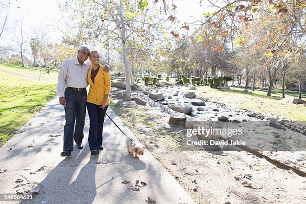 husband and wife taking walk, hahn park, los angeles, california, usa - african american couple walking park ストックフォトと画像