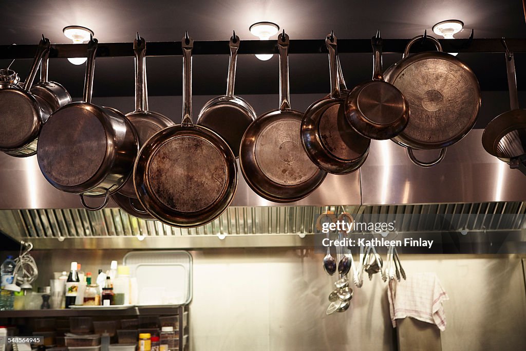 Pans hanging in commercial kitchen