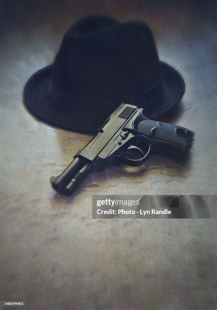 Gun and trilby