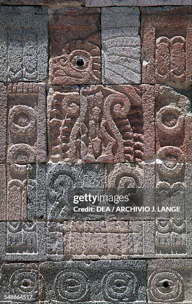 Feathered serpent, relief on a pillar in the inner courtyard in the Palace of Quetzalpapalotl, Teotihuacan , Anahuac, Mexico. Teotihuacan...