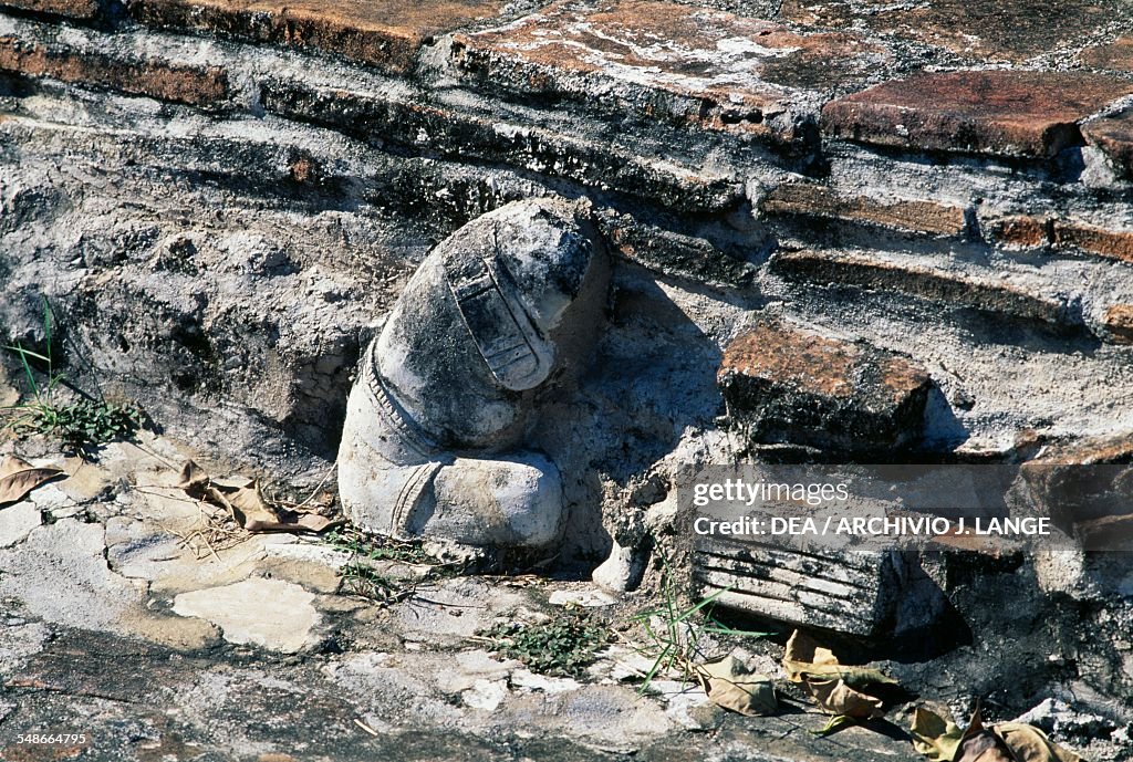 Stucco figure inserted in Structure 3...