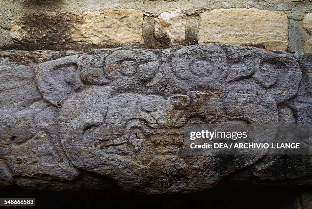 Lintel decorated with a jaguar head at the entrance of Tomb 7, Dainzu, Valley of Oaxaca, Mexico. Zapotec civilisation, 7th century BC-16th century.
