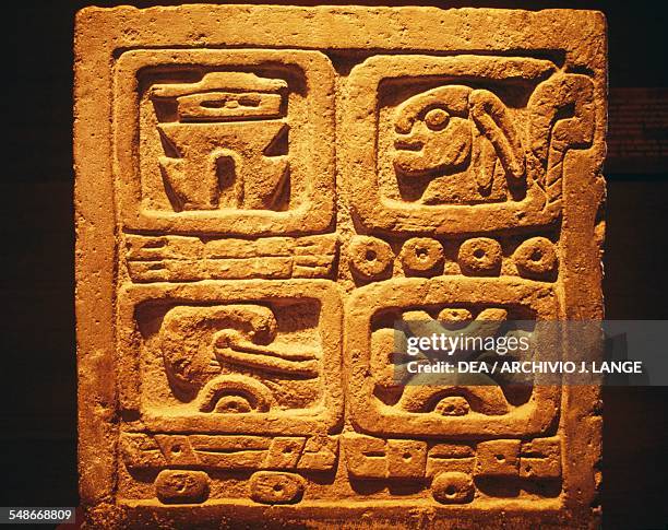 Stele with four glyphs representing the two systems of the Nahua and Zapotec calendars. Mesoamerican civilisation, 7th-9th century. Mexico City,...