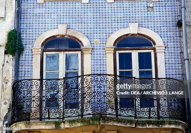House covered with azulejo tiles on Praca do Comercio, Coimbra, Centro, Portugal.