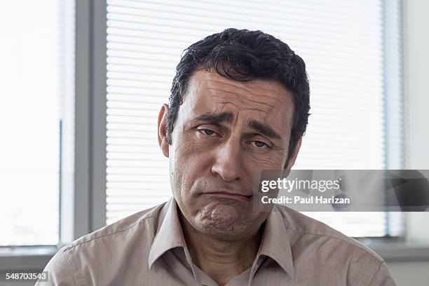 portrait of a depressed businessman in office - expression stress stock pictures, royalty-free photos & images