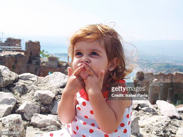 girl blowing a kiss - naxos sicily stock-fotos und bilder