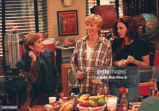 From left, American actresses Carrie Fisher, Ellen Degeneres, and Joely Fisher perform in a scene from an episode of the television show 'Ellen' at...