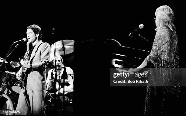From left, American musician Lindsey Buckingham and British musicians Mick Fleetwood and Christine McVie of the group Fleetwood Mac perform onstage...