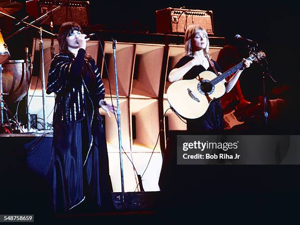 Sibling American musicians Ann and Nancy Wilson of the rock group Heart perform onstage at the Universal Amphitheatre, Los Angeles, California, July...