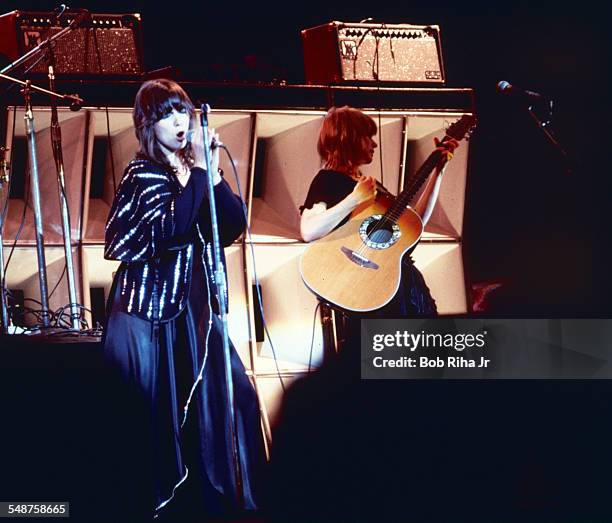 Sibling American musicians Ann and Nancy Wilson of the rock group Heart perform onstage at the Universal Amphitheatre, Los Angeles, California, July...