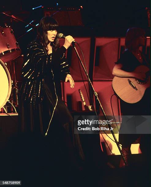 Sibling American musicians Ann and Nancy Wilson of the rock group Heart perform onstage at the Universal Amphitheatre, Los Angeles, California, July...