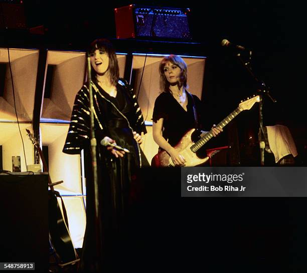 Sibling American musicians Ann and Nancy Wilson of the rock group Heart perform onstage at the Universal Amphitheatre, Los Angeles, California, July...