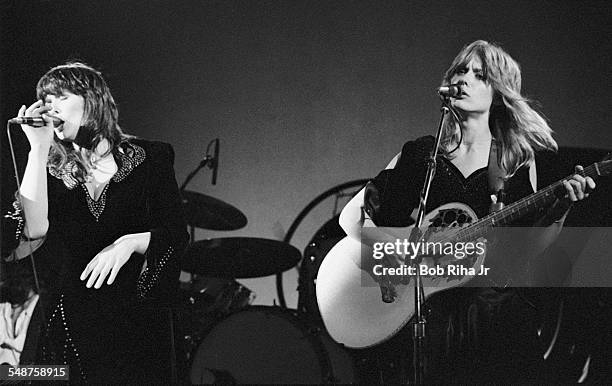 Sibling American musicians Ann and Nancy Wilson of the rock group Heart perform onstage at the Universal Amphitheatre, Los Angeles, California, July...