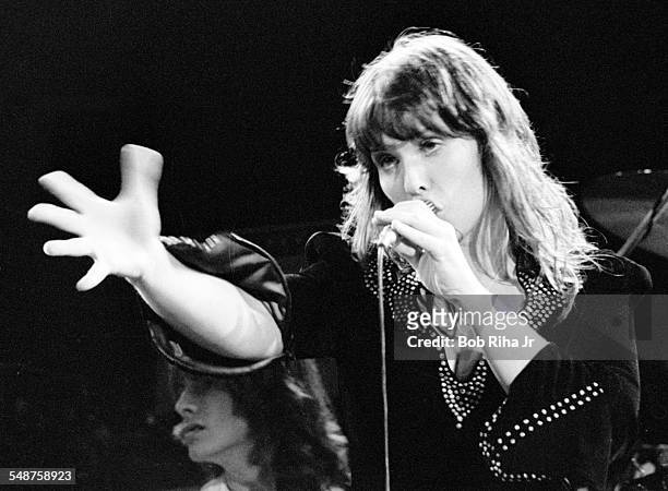 American musician Ann Wilson of the rock group Heart performs onstage at the Universal Amphitheatre, Los Angeles, California, July 15, 1977. Visible...