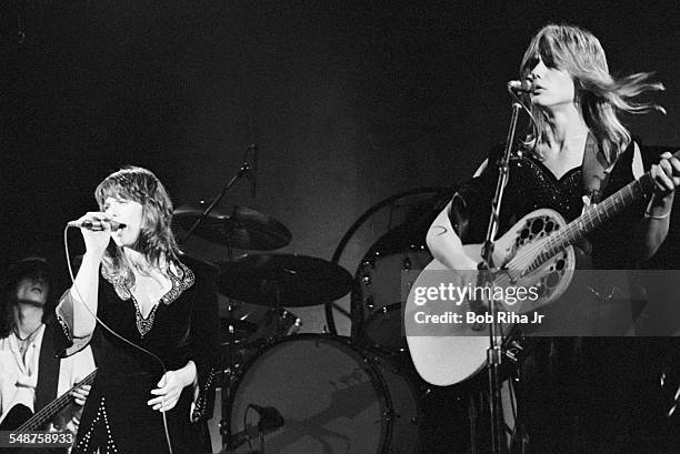 Sibling American musicians Ann and Nancy Wilson of the rock group Heart perform onstage at the Universal Amphitheatre, Los Angeles, California, July...