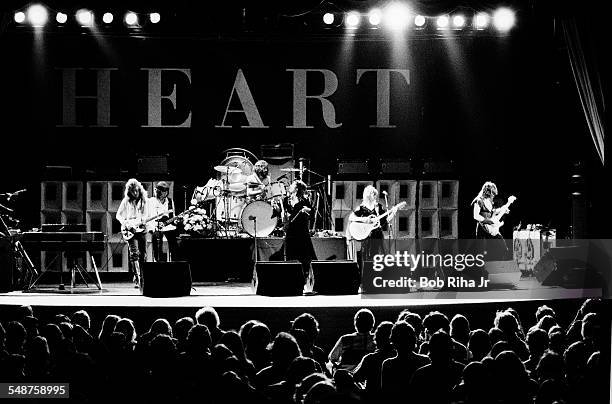 American rock group Heart performs onstage at the Universal Amphitheatre, Los Angeles, California, July 15, 1977. Pictured are, from left, American...