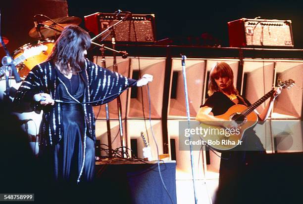 Sibling American musicians Ann and Nancy Wilson of the rock group Heart perform onstage at the Universal Amphitheatre, Los Angeles, California, July...