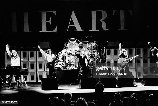 American rock group Heart performs onstage at the Universal Amphitheatre, Los Angeles, California, July 15, 1977. Pictured are, from left, American...