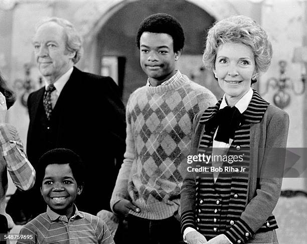 From left, view of Canadian actor Conrad Bain , American actors Gary Coleman and Todd Bridges, and US First Lady Nancy Reagan on the set of the...