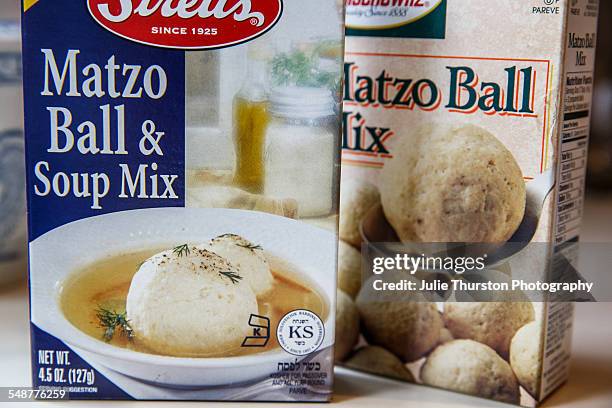 Boxed Jewish traditional Matzo Ball and soup mix on a kitchen counter. Two different brands of convenient prepared mix ready to boil and serve for...