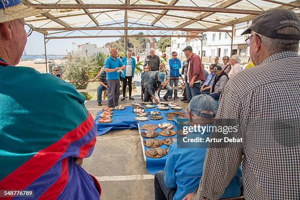 Fresh fish recently fished on the morning day for sale on auction in a traditional sung fish monger in the Barcelona shoreline. Mongat, Catalonia,...