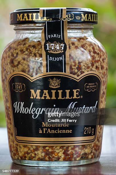 Jar of French Maille wholegrain Dijon mustard.