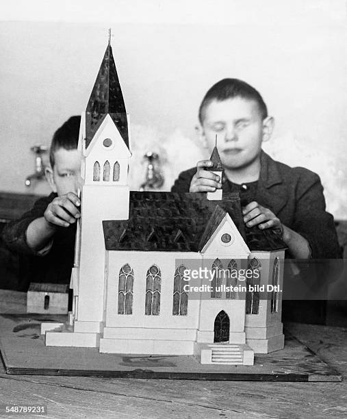 Germany Free State Prussia Berlin Berlin: State Institution for the Blind in Berlin-Steglitz, pupils fumbling a model of a church - 1930 -...