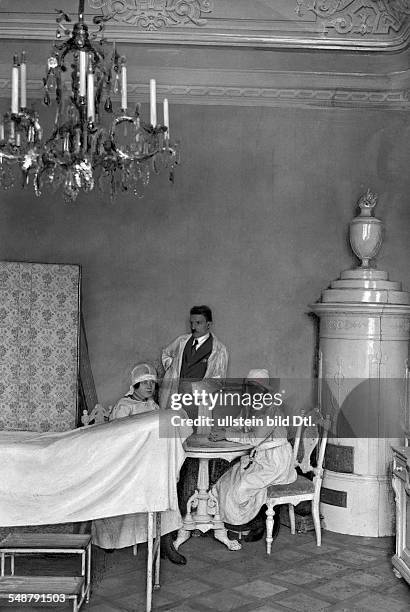 Austria Vienna Vienna: Invalids home in the Castle Schoenbrunn, a physician and two nurses in the former parlour in the Valerie tract - 1922 -...