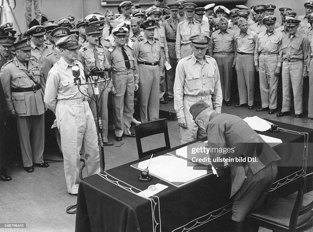 World War II in the Pacific Japanese Surrender aboard the USS Missouri in Tokyo Bay, September 2, 1945; General Yoshijiro Umezo is signing the surrender document for the Imperial Japanese Army -