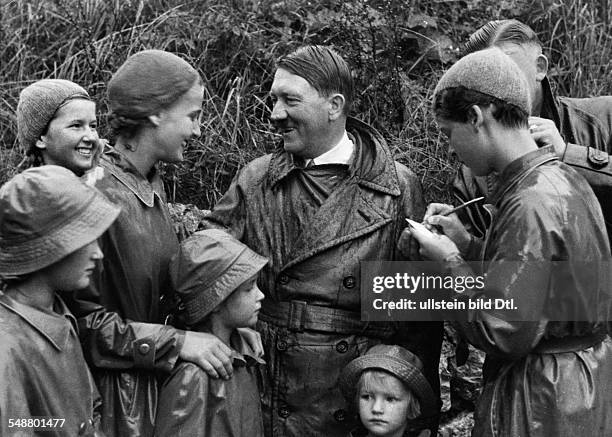Hitler, Adolf - Politician, NSDAP, Germany *20.04.1889-+ - with children and adolescents during a public appearance - 1936 - Photographer:...