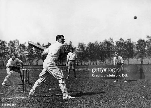 Germany : pupils of a South German school, the boys playing with thier English teacher Cricket - 1933 - Photographer: Kurt Huebschmann - Vintage...