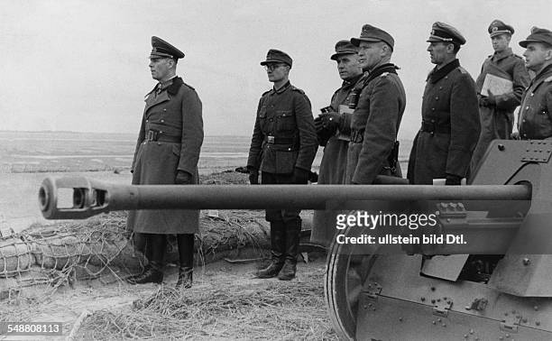 NGerman Field Marshal. Rommel, commander of the German Afrika Korps, inspecting the German position at the Atlantic Wall near Fecamp, Normandy,...