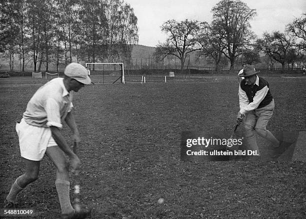 Germany : pupils of a South German school, the boys playing with the drector of the school Cricket - 1933 - Photographer: Kurt Huebschmann - Vintage...