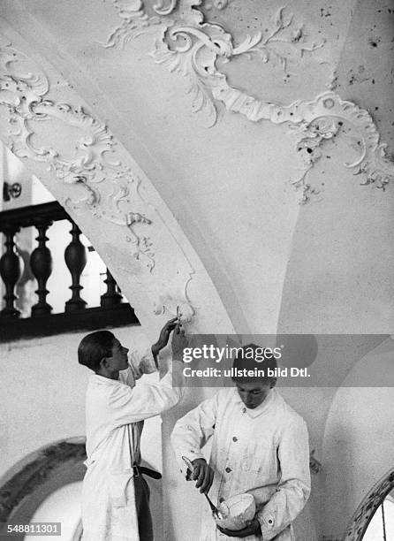 Germany : pupils of a South German school, members of the repair commission restaurating the old in stucco the castle - 1933 - Photographer: Kurt...