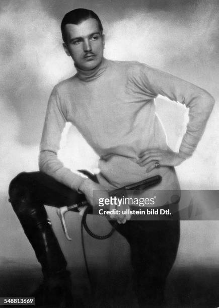 Man wearing horse riding clothes with riding boots and riding crop - undated - Photographer: Mario von Bucovich - Published by: 'Die Dame' 10/1927...