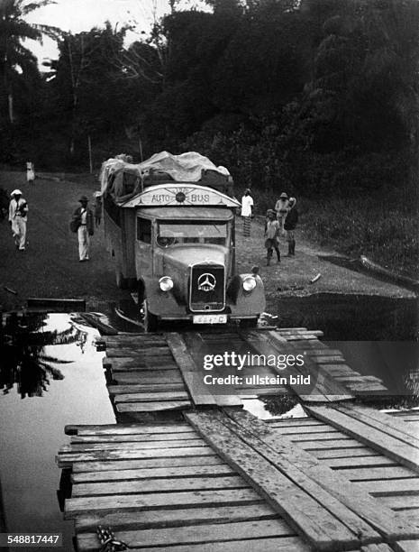 Autobus crossing a river on a unstable wooden bridge - um 1938 - Photographer: Erich Andres - Published by: 'Berliner Illustrirte Zeitung' 11/1938...