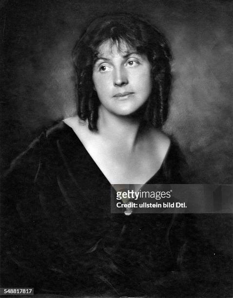 Fashion: Mrs Dr Weyringer in a velvet dress with a cameo at the neckline and curls - 1919 - Photographer: Edith Barakovich - Published by: 'Die Dame'...