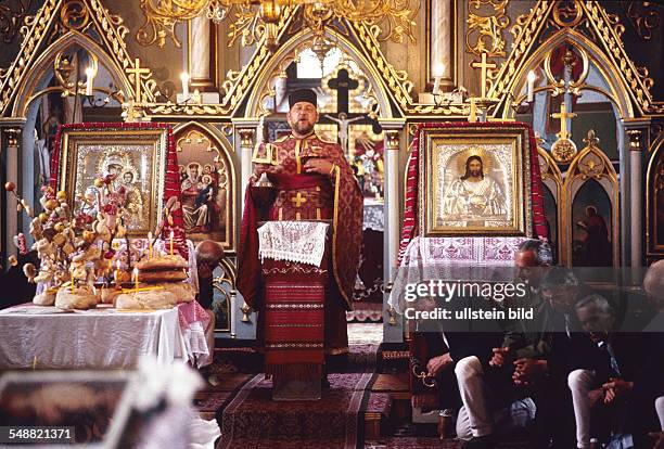 Romania: A requiem mass in the orthodox church of Hodac.