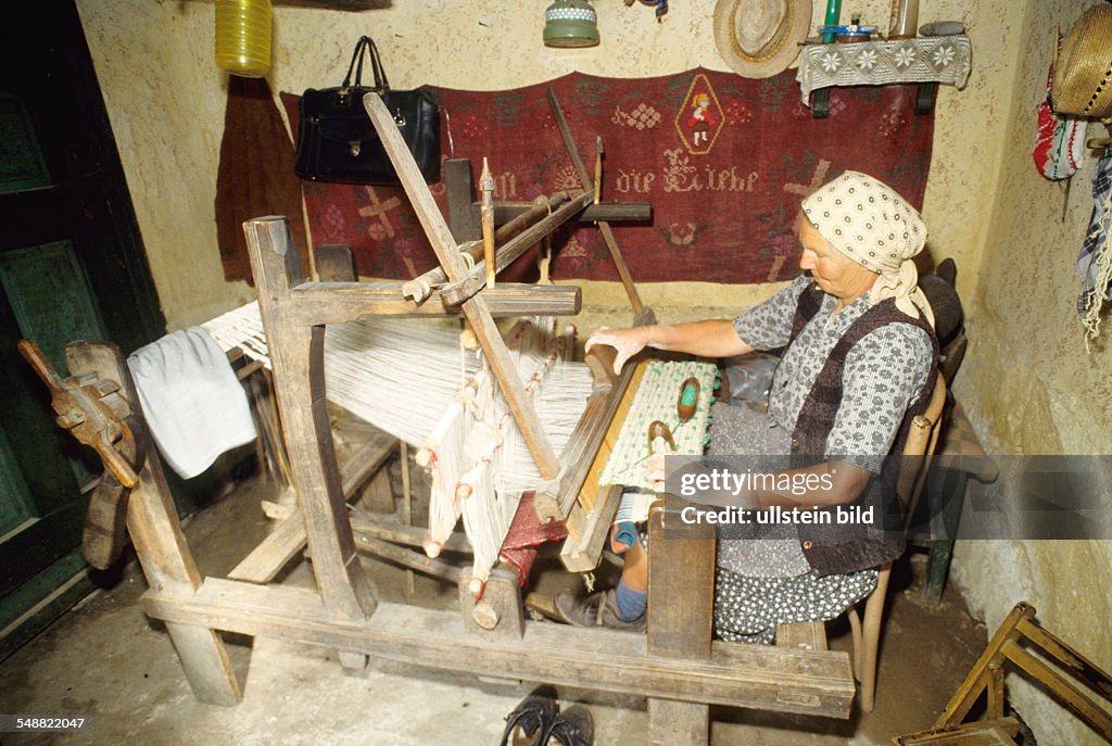 RUM, Romania: Local people in the village of Logic. A loom.